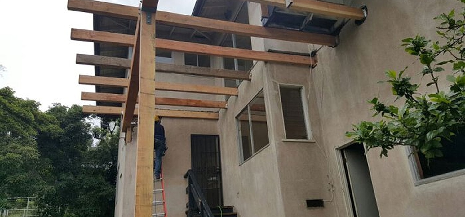 Construction work on a residential building exterior.