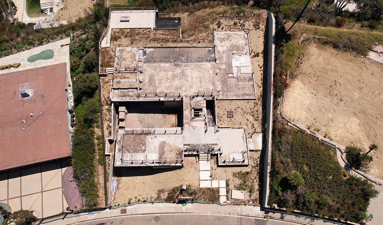 Aerial view of an unfinished building site.