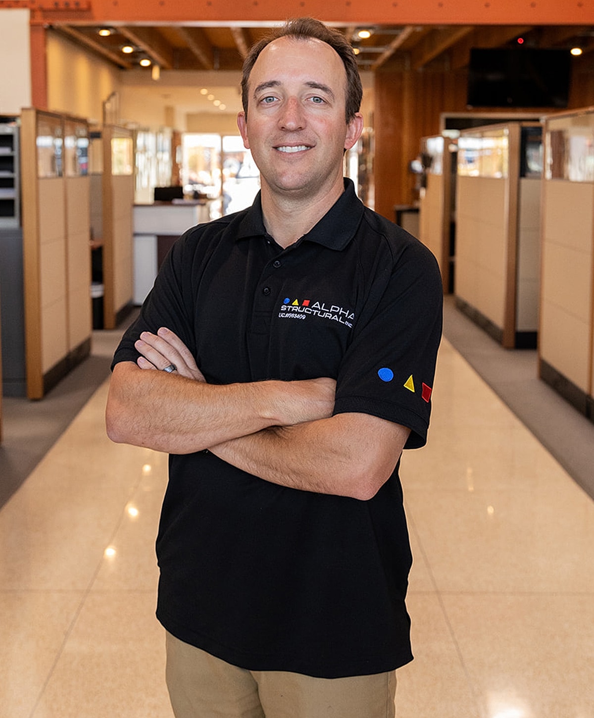 Business professional smiling in office setting.