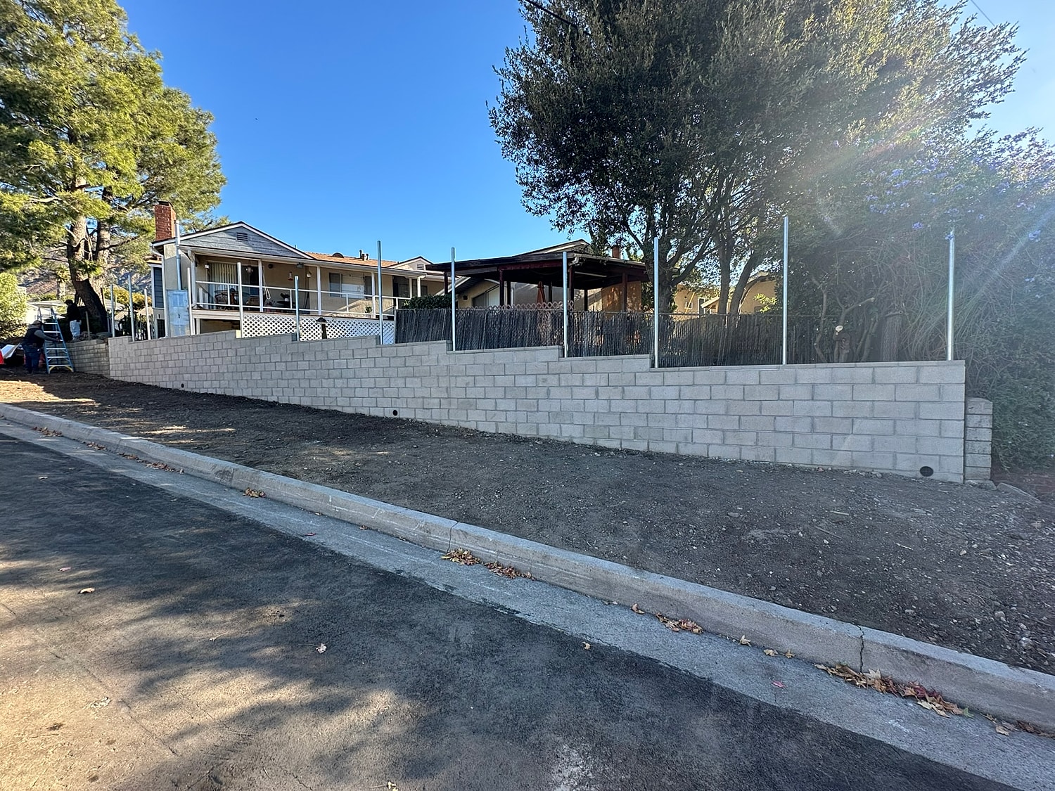 Newly constructed retaining wall in urban setting