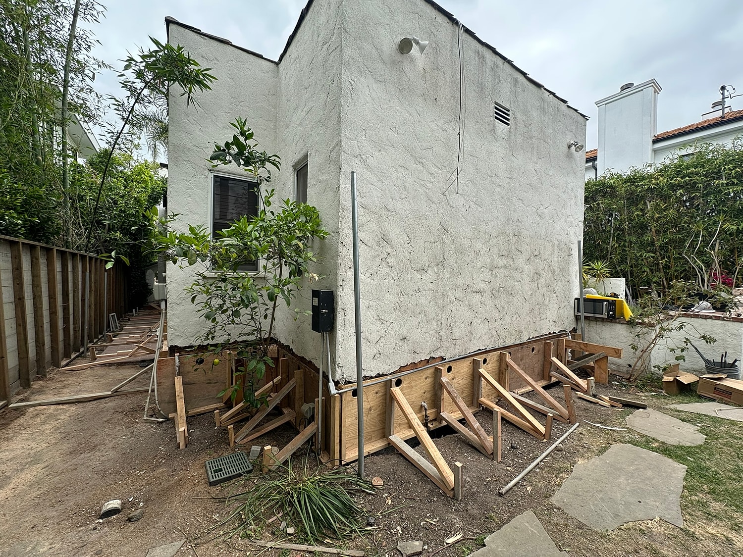 Home renovation with wooden supports visible.