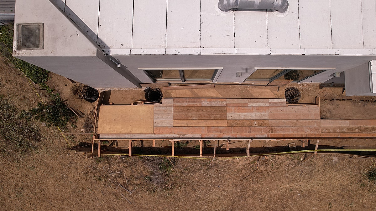 Aerial view of wooden deck construction site.