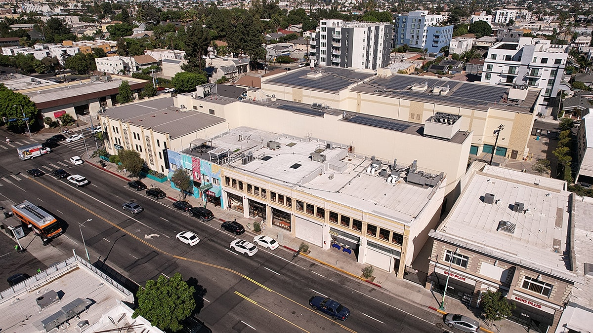 Aerial view of urban buildings and street.