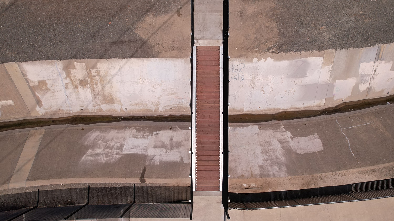 Aerial view of a bridge over a channel.