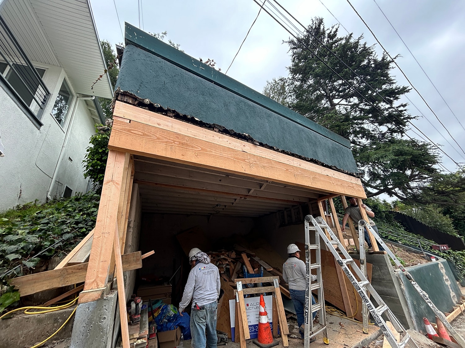 Construction workers at a building renovation site.
