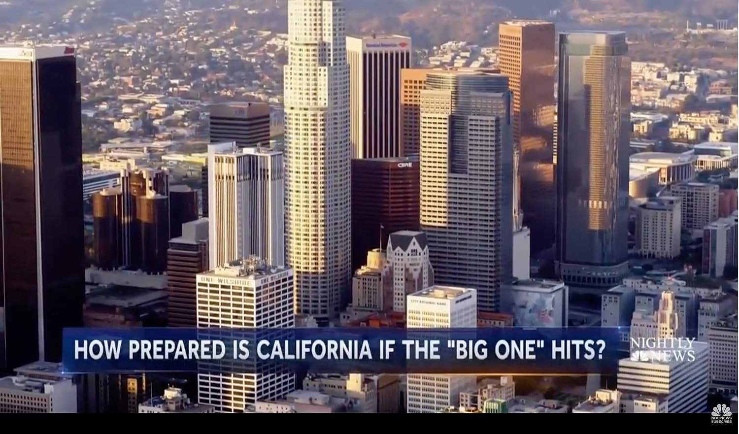 Los Angeles skyline with earthquake preparedness news.