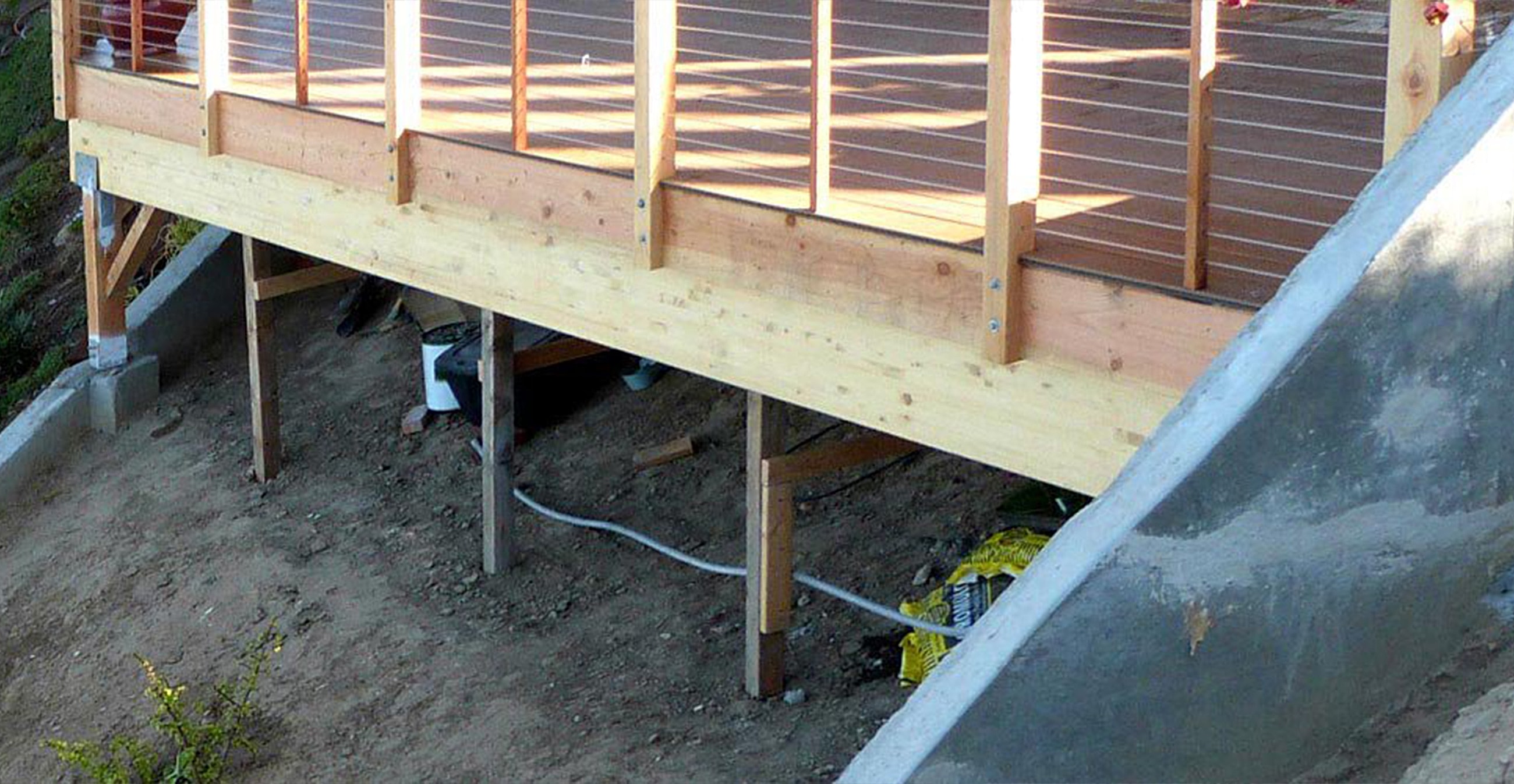 Wooden deck structure with visible support beams.