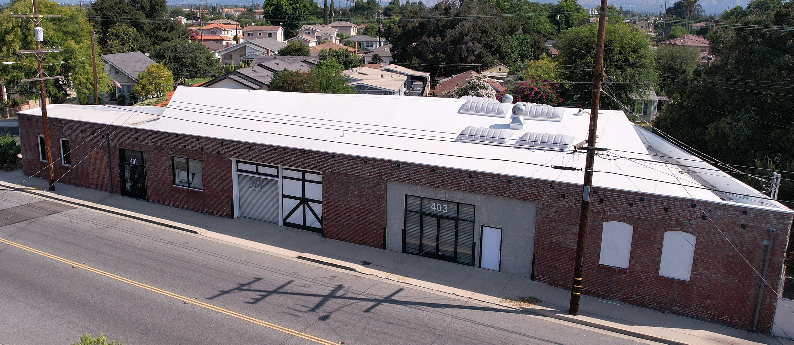 Warehouse building with brick facade and windows.
