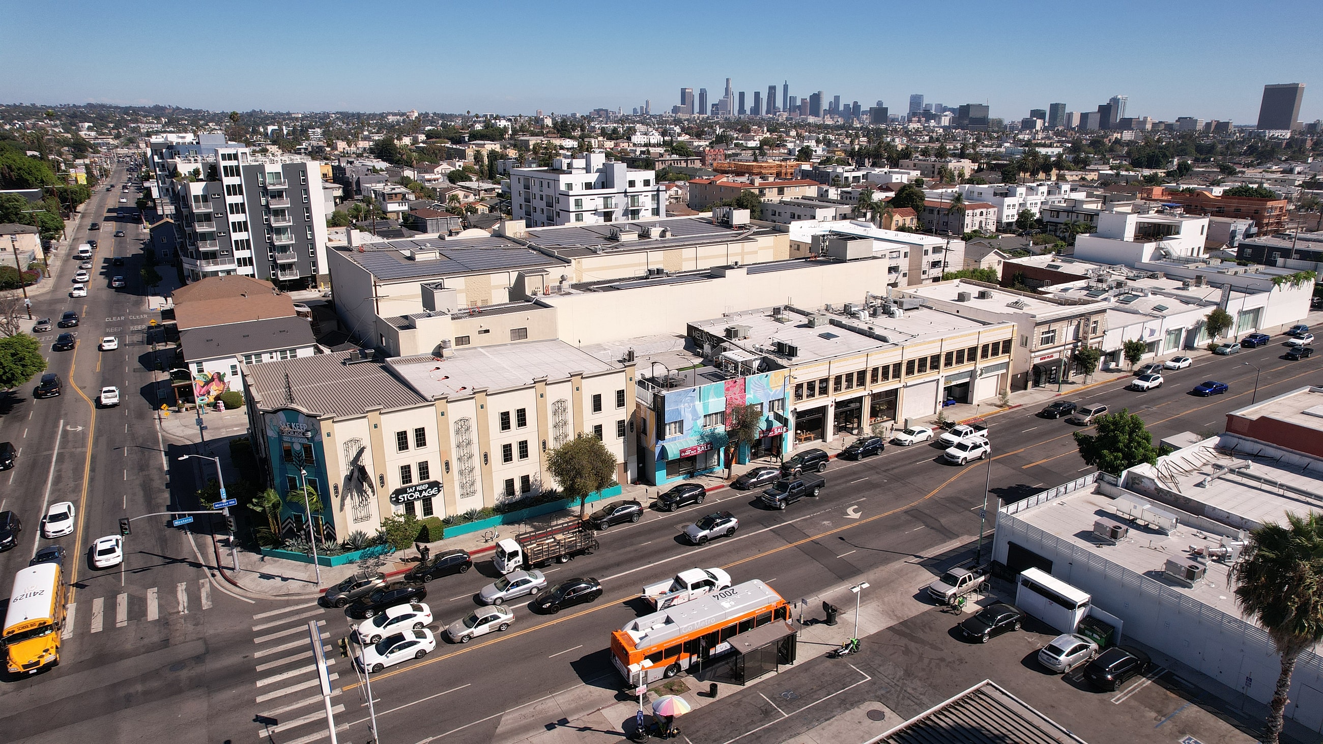 Aerial view of a busy urban street scene.