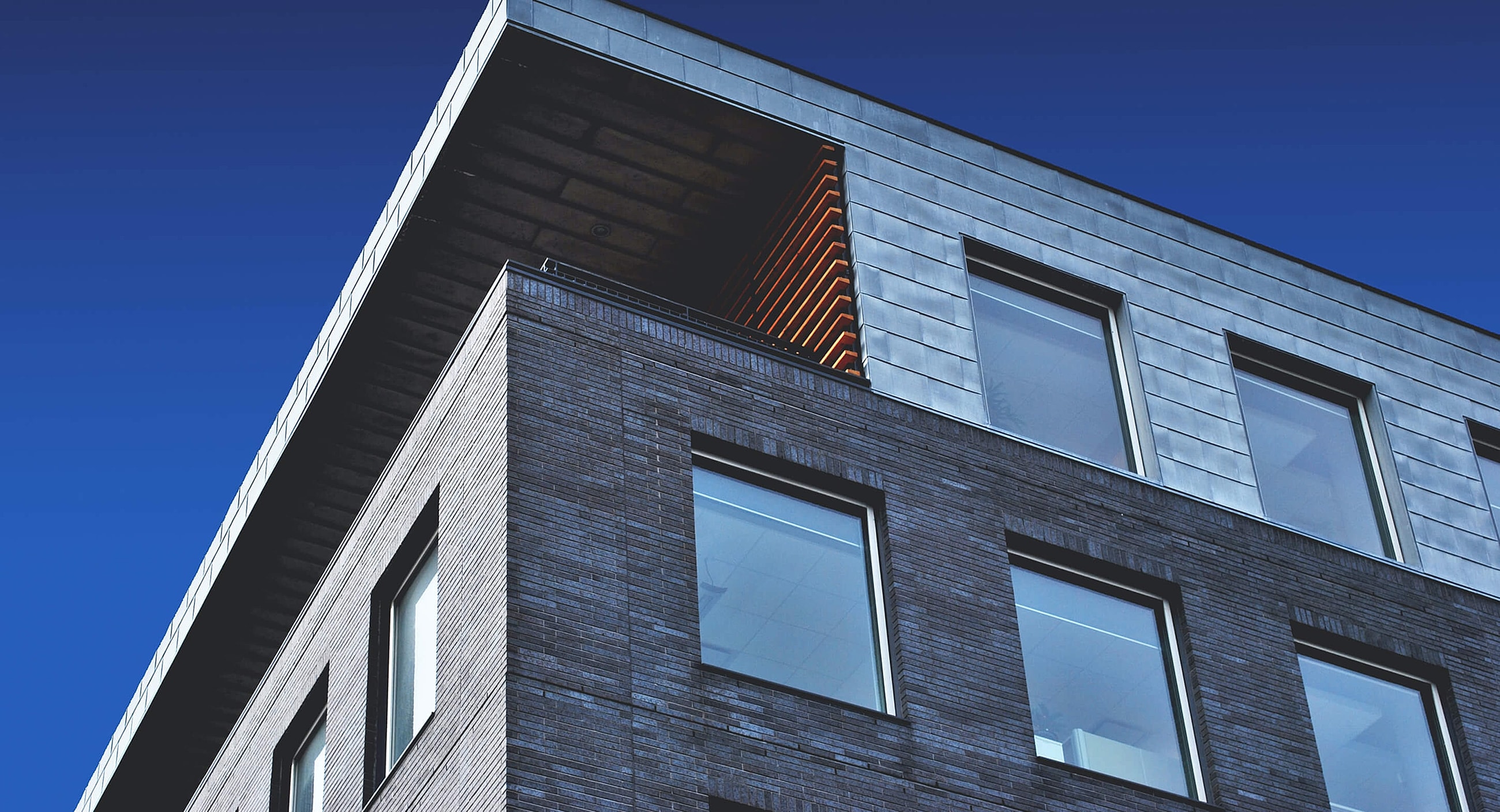 Modern building with clear blue sky backdrop.