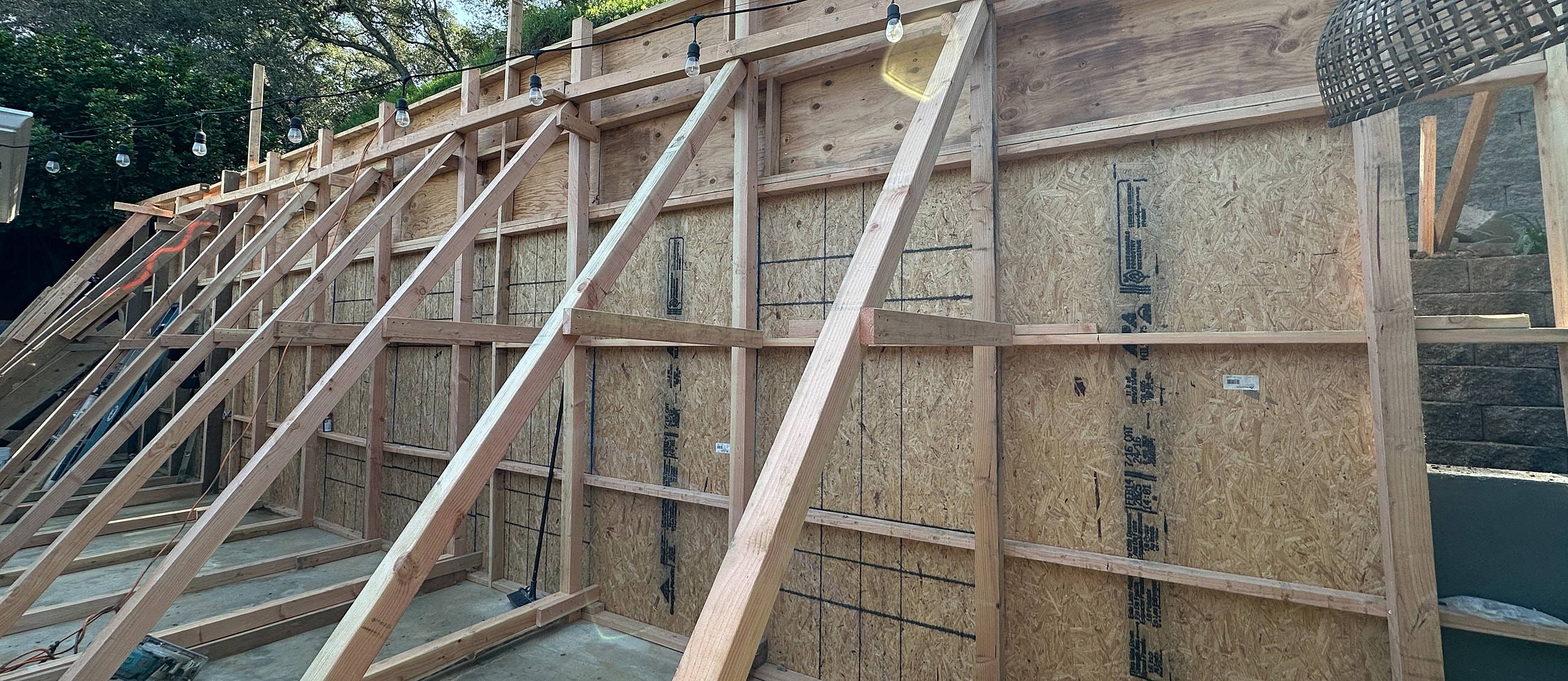 Framing structure under construction with wooden supports.