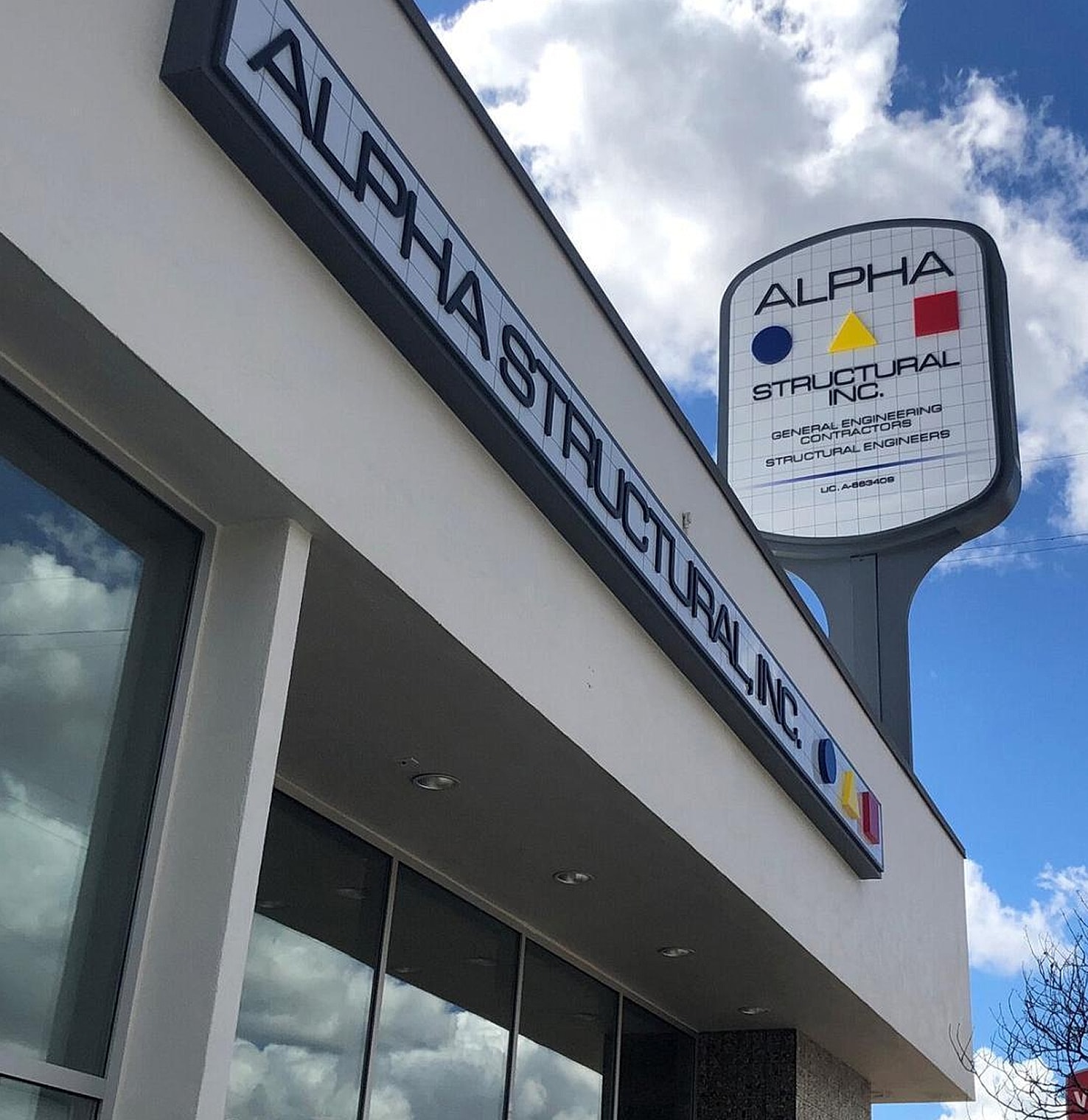 Sign for Alpha Structural Inc. building.