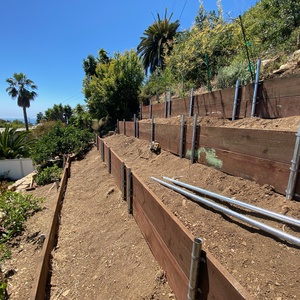 Pipe & Board Hillside Repair